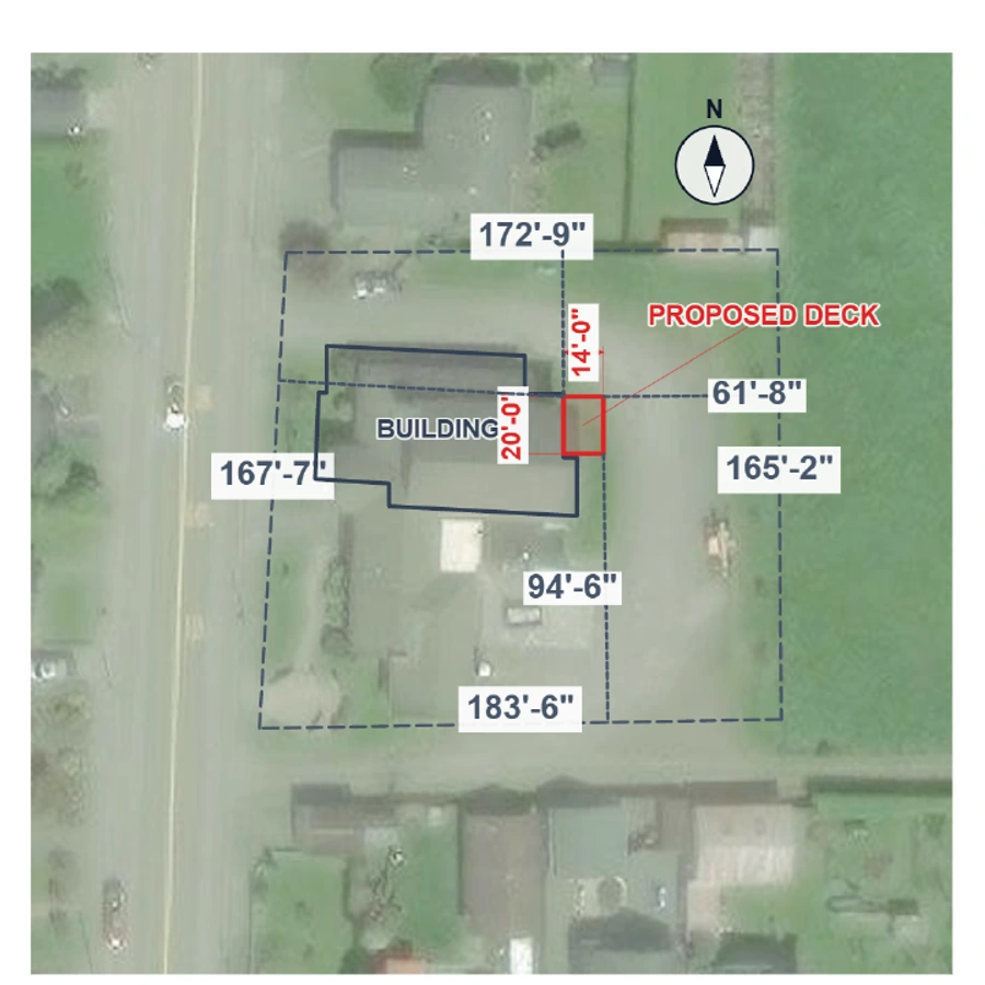 Illustrative 20 by 14 foot deck attached to a building, both inside the traced lot, over actual aerial imagery